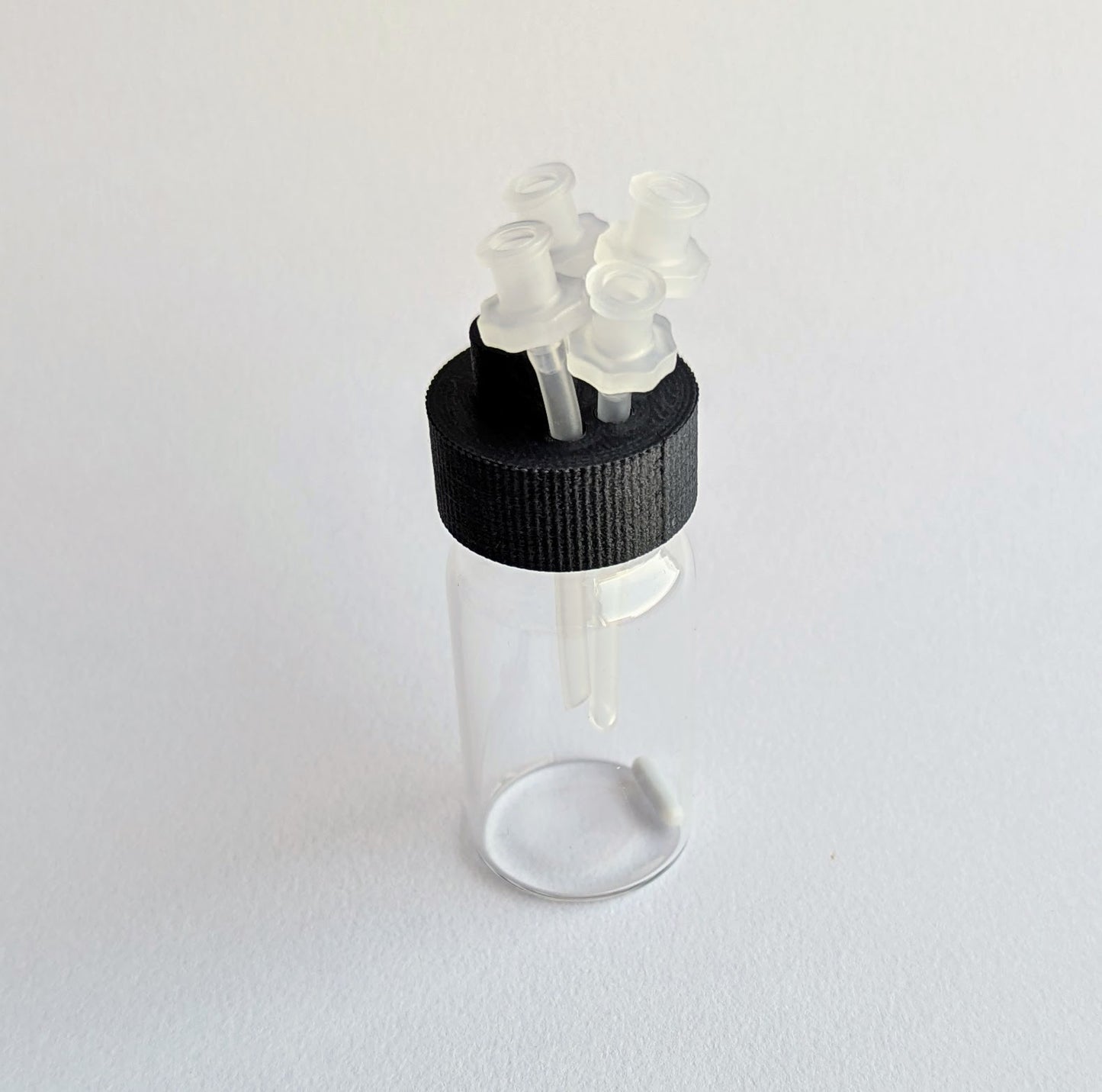 20mL glass vial, cap with ports, and stir bar